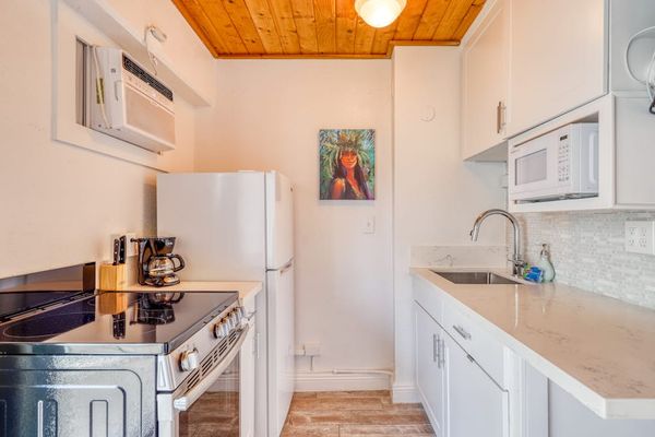 Cook, gather, and enjoy casual dining in this inviting kitchen space.