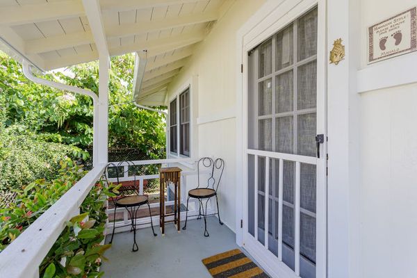 A warm welcome awaits behind this inviting cottage front entrance every time