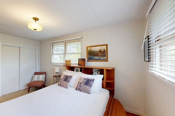 Cozy queen bed creates the perfect retreat inside the welcoming master bedroom