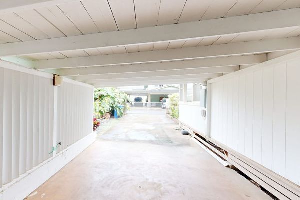 Convenient carport offers sheltered parking just steps from the welcoming home entrance