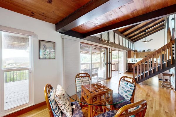 Enjoy sunlit meals in a welcoming dining area filled with tropical charm.