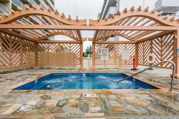 Enjoy a soothing soak in the shared hot tub during your stay