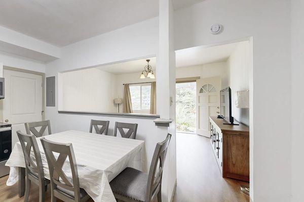 Gather around the table and enjoy meals together in a warm and inviting dining space.