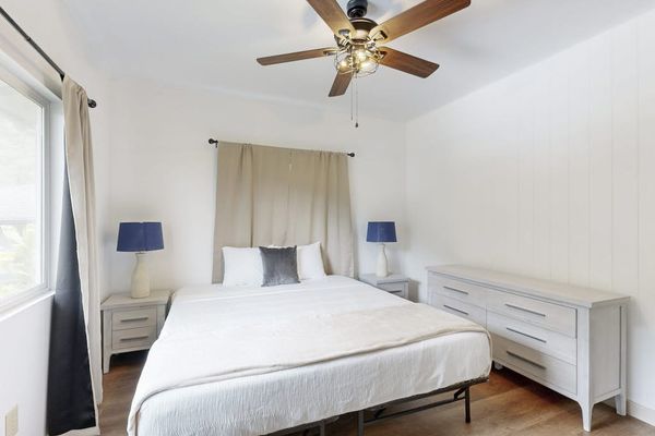 Rest comfortably in a welcoming bedroom featuring a spacious king-size bed.