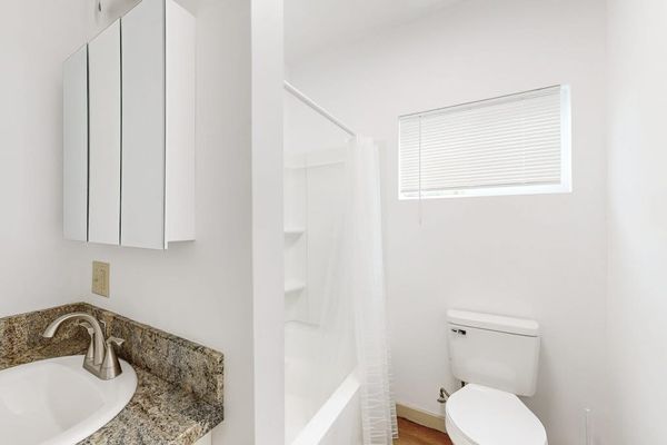 Refresh and unwind in a comfortable bathroom featuring both a bathtub and shower.