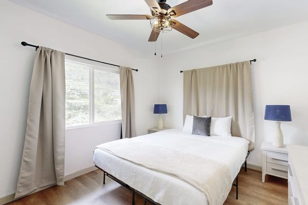 Unwind in a spacious bedroom featuring a king-size bed for a restful night's sleep.