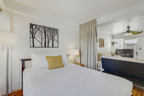 Unwind after a day of exploring in this inviting bedroom with a spacious queen-size bed.