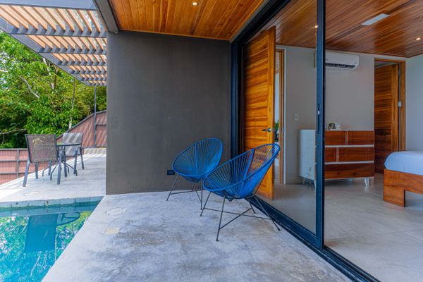 Relax on the private terrace just steps from the pool and bedroom.