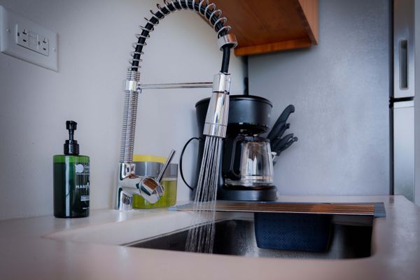 Kitchen essentials provided, including coffee maker and cooking utensils.
