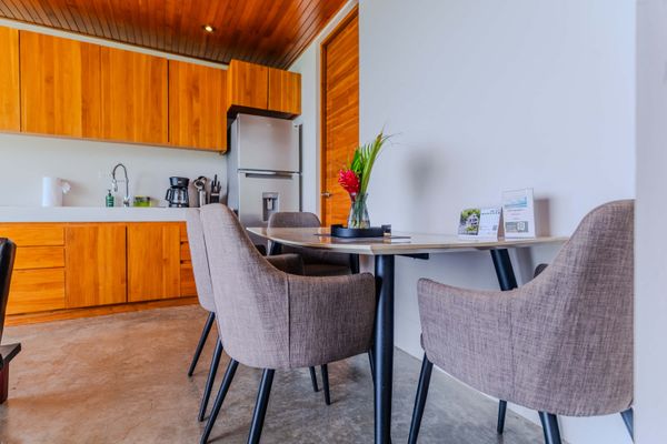 A comfortable dining setup with modern amenities and thoughtful details for guests.