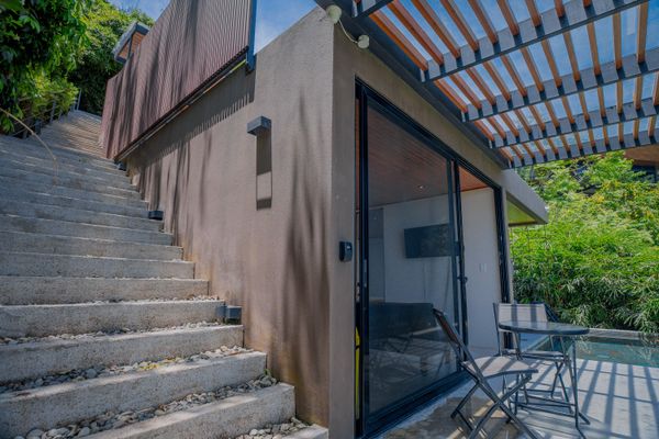 A private stairway entrance leads you into the villa’s serene tropical setting.