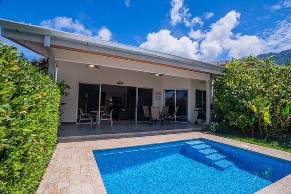 Charming home with a spacious pool area and a convenient grilling space
