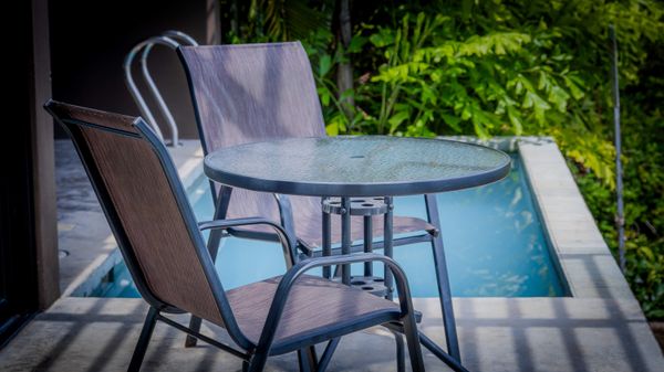 Sip your morning coffee or evening drink beside the private pool.