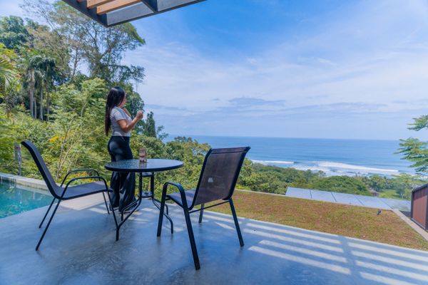 Outdoor dining area with stunning ocean views, perfect for morning coffee or sunset drinks.