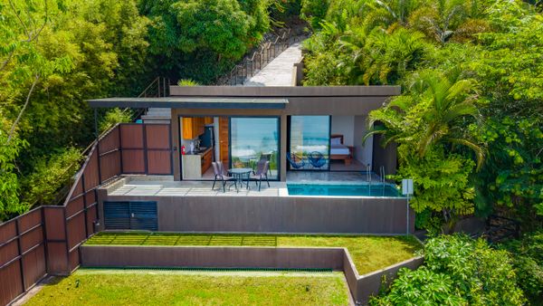 This modern tropical villa offers a private pool and a seamless indoor-outdoor layout.