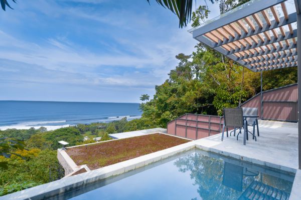 Sweeping ocean views from the pool terrace surrounded by lush tropical scenery.