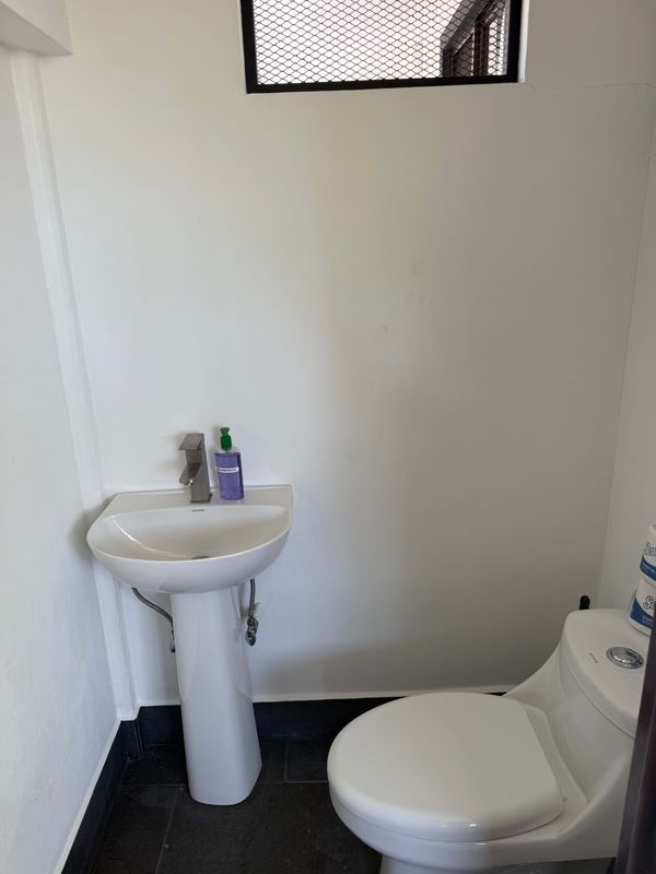 Convenient half bathroom for the pool and bar area so Guests don't have to go inside the home while outside.