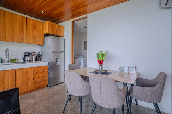 Cozy dining area with fresh tropical flowers and a welcoming atmosphere.