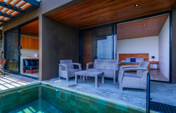 Relax by the pool just steps from the bedroom and covered terrace.