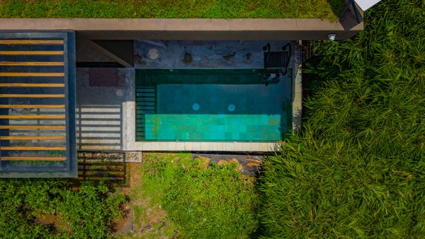 A private pool retreat surrounded by nature, perfect for cooling off after a beach day.