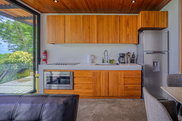A thoughtfully equipped kitchen with warm wood finishes for easy vacation meals.