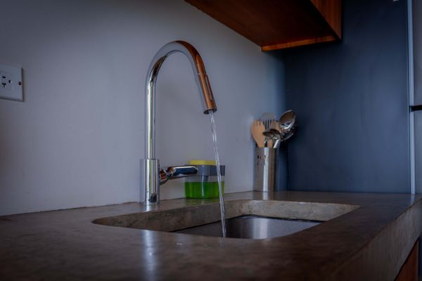 Modern kitchen fixtures and essentials make everyday use easy and practical.
