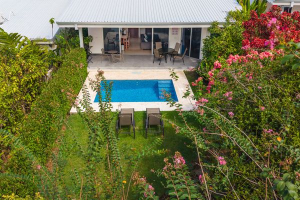 Lush green zone surrounding the villa for peaceful outdoor moments.