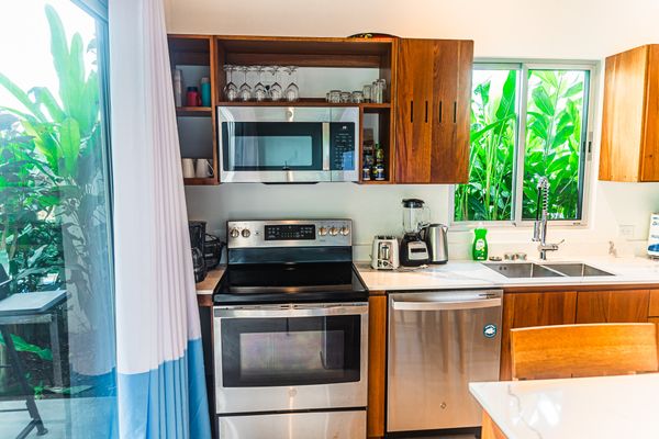 functional kitchen with an efficient oven, perfect for baking and cooking.