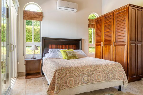 Bedroom #2 has a queen-size be, air conditioning and access to the outdoor patio.