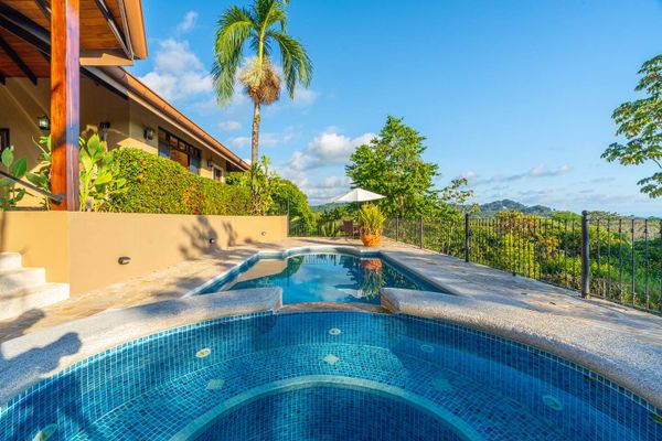 Large swimming pool with smaller plunge pool for sitting and relaxing