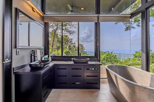 En suite bathroom for Bedroom #3 with ocean and jungle views.