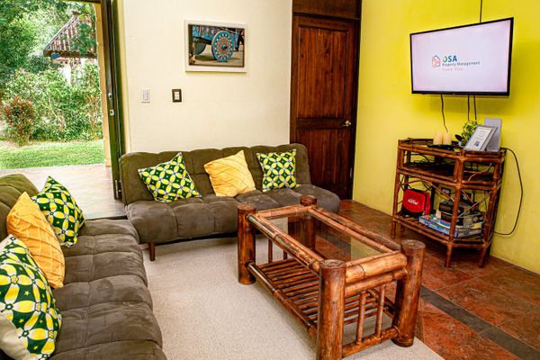 With its grand proportions, this living room offers an inviting space for family time and entertaining guests