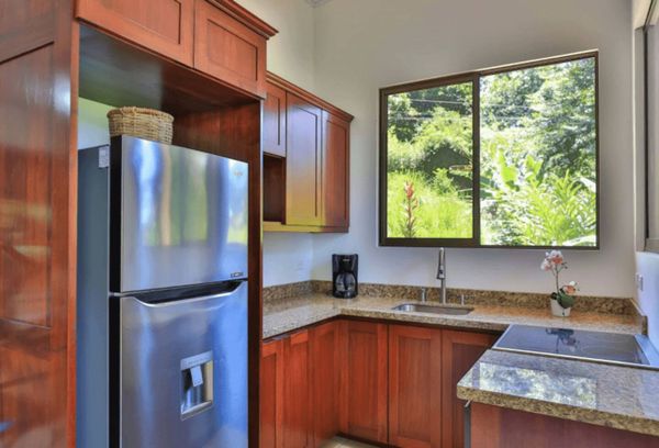 charming and cozy kitchen , designed for warmth and functionality.