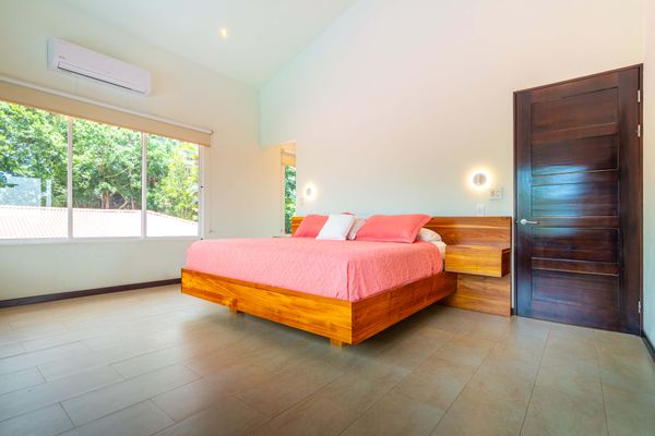 Owner's Suite is spacious, has a king-size bed, A/C, TV, en-suite/private bathroom.