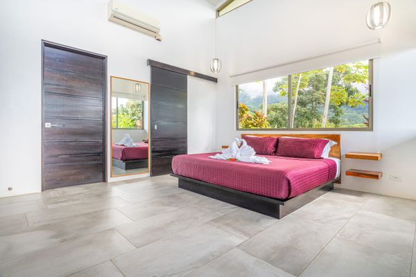 Suite #1 has ocean views, mountain views, access to the private pool, along with en-suite bathroom, air conditioning and ceiling fan.