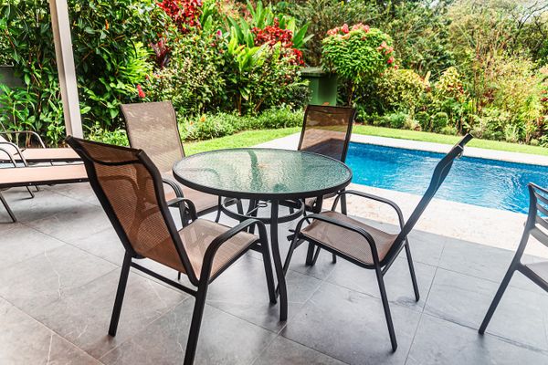Enjoy your meals by the pool in a beautiful, relaxed setting.