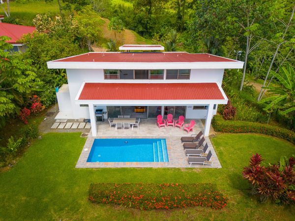 An aerial view of the house, showcasing its beautiful layout and surrounding landscape