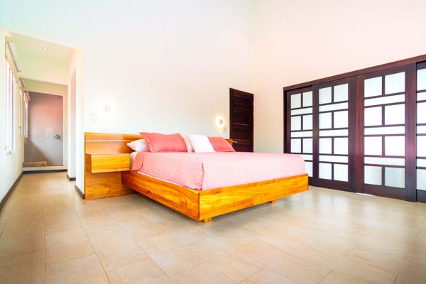 Owner's Suite is spacious, has a king-size bed, A/C, TV, en-suite/private bathroom.