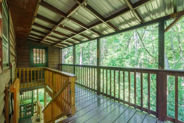 Porch to downstairs rooms and washer/dryer area