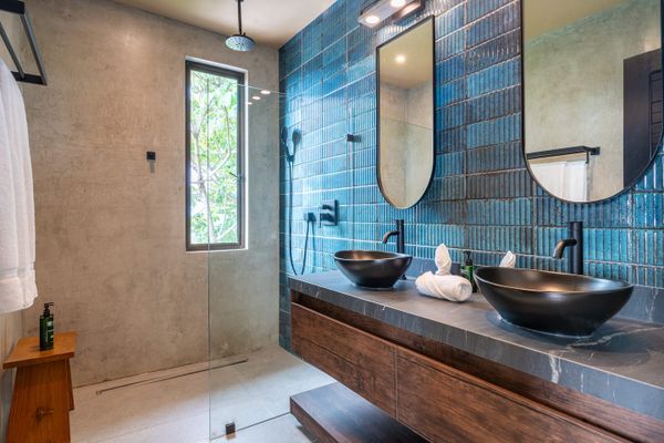 spacious bathroom featuring two stylish sinks, perfect for shared comfort.