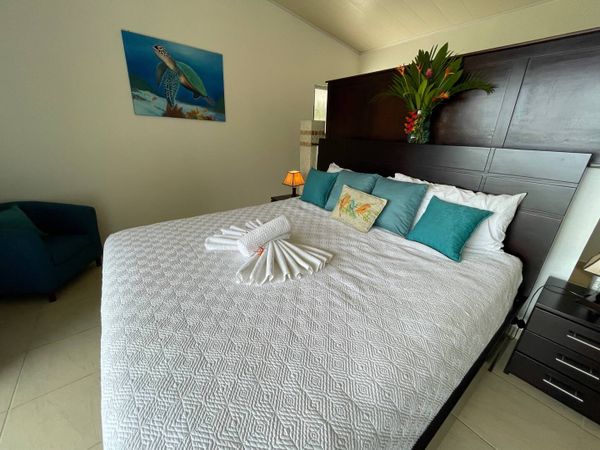 Owner's Suite has king-size bed, en suite bathroom, private balcony.