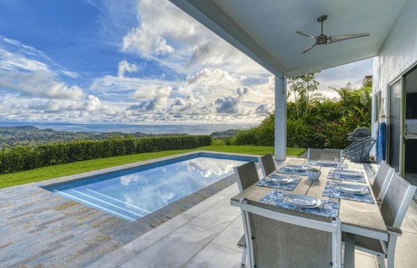 A stunning blend of the sky and pool area, creating a serene and picturesque view.