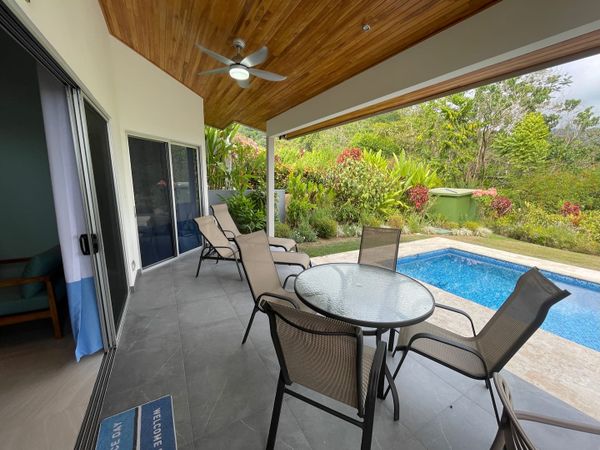 A spacious poolside area, perfect for lounging and enjoying the outdoors.