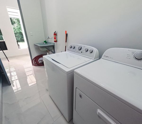 In-home clothes washer and clothes dryer is free to use. Detergent is not provided