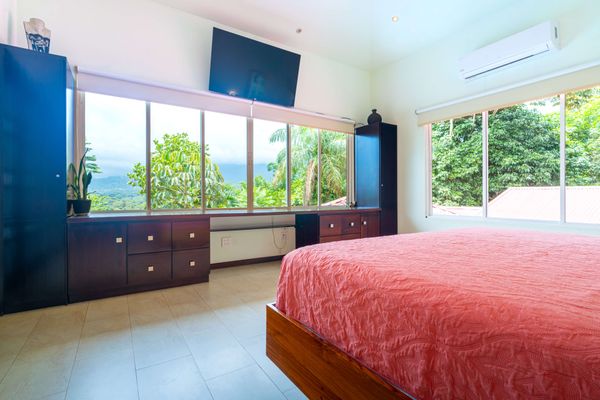 Owner's Suite is spacious, has a king-size bed, A/C, TV, en-suite/private bathroom.