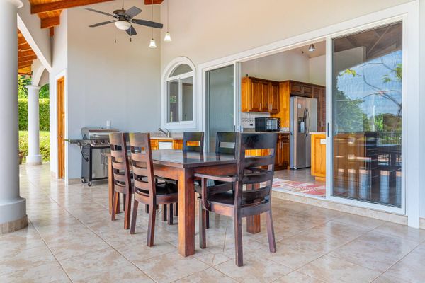 Chairs and a table perfect for outdoor dining by the pool
