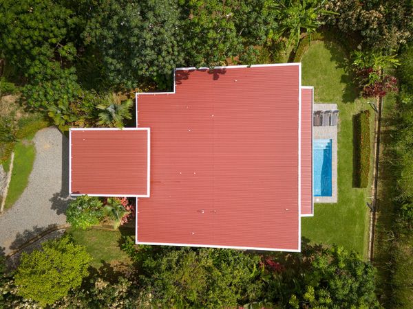 Different angles of the house’s exterior, emphasizing its elegant details and surroundings