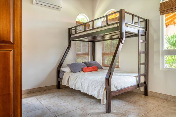 well-designed room with a bunk bed, ideal for maximizing space.