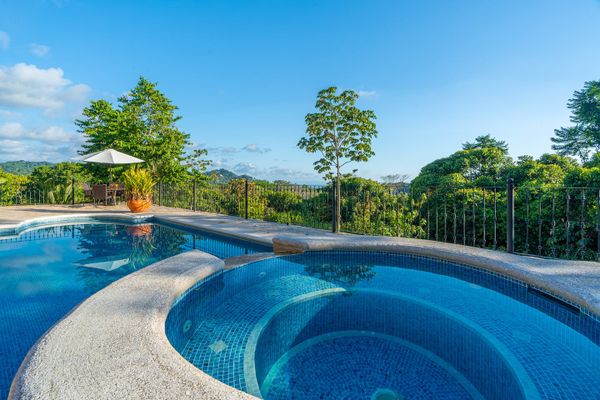 Large swimming pool with smaller plunge pool for sitting and relaxing