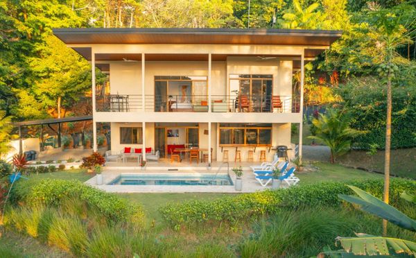 A stunning front  with elegant architecture and beautifully landscaped surroundings.